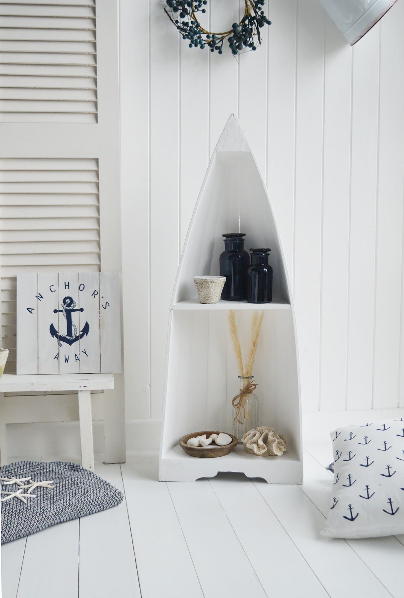 White coastal Boat Shelf with blue accessories for a traditional New England Beach Look